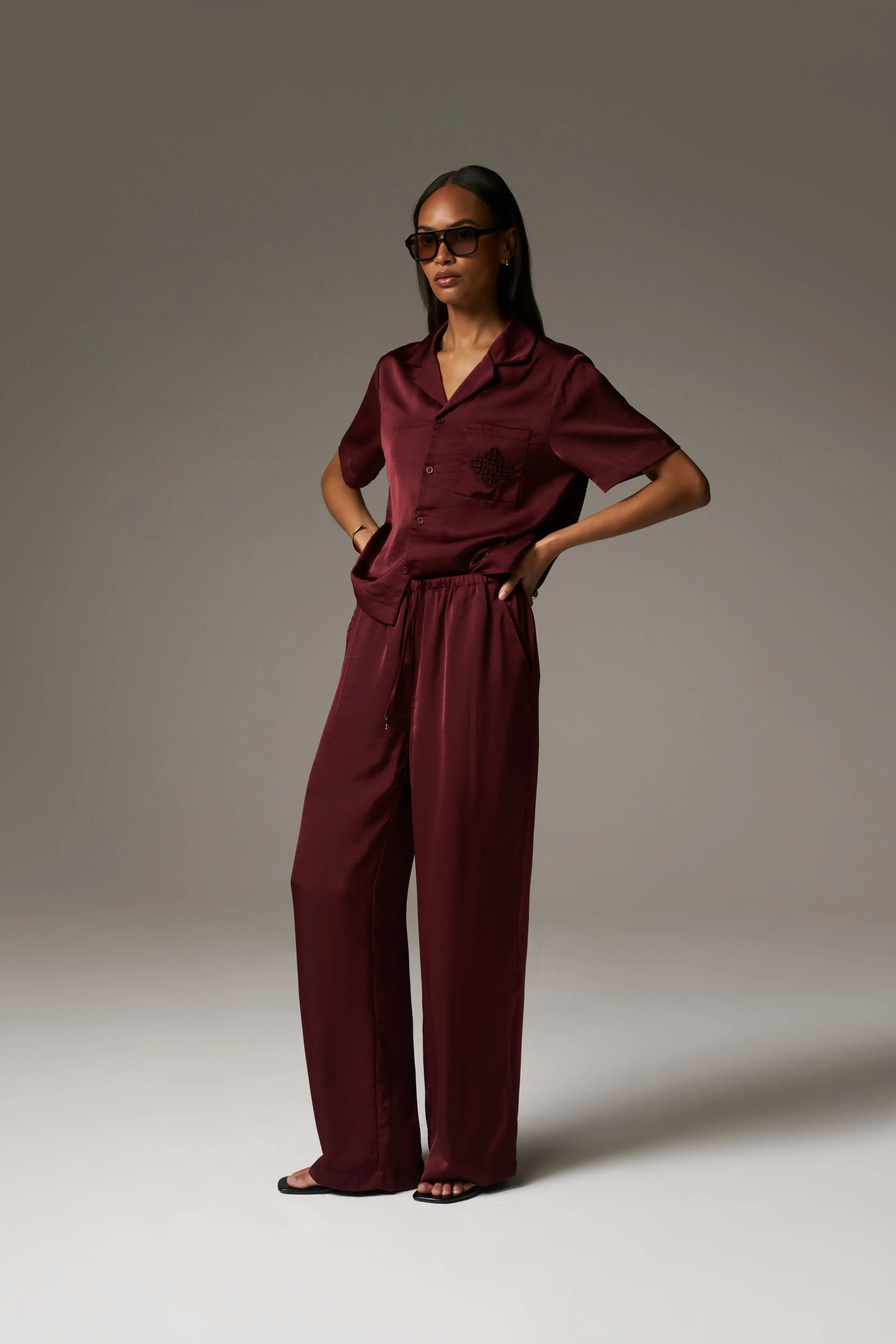 SATIN WIDE LEG EMBLEM TROUSERS - BURGUNDY